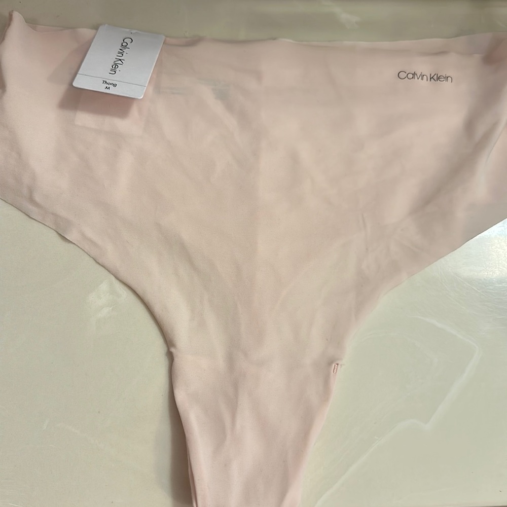 Calvin Klein no show M thong. Nylon, cotton gusset.